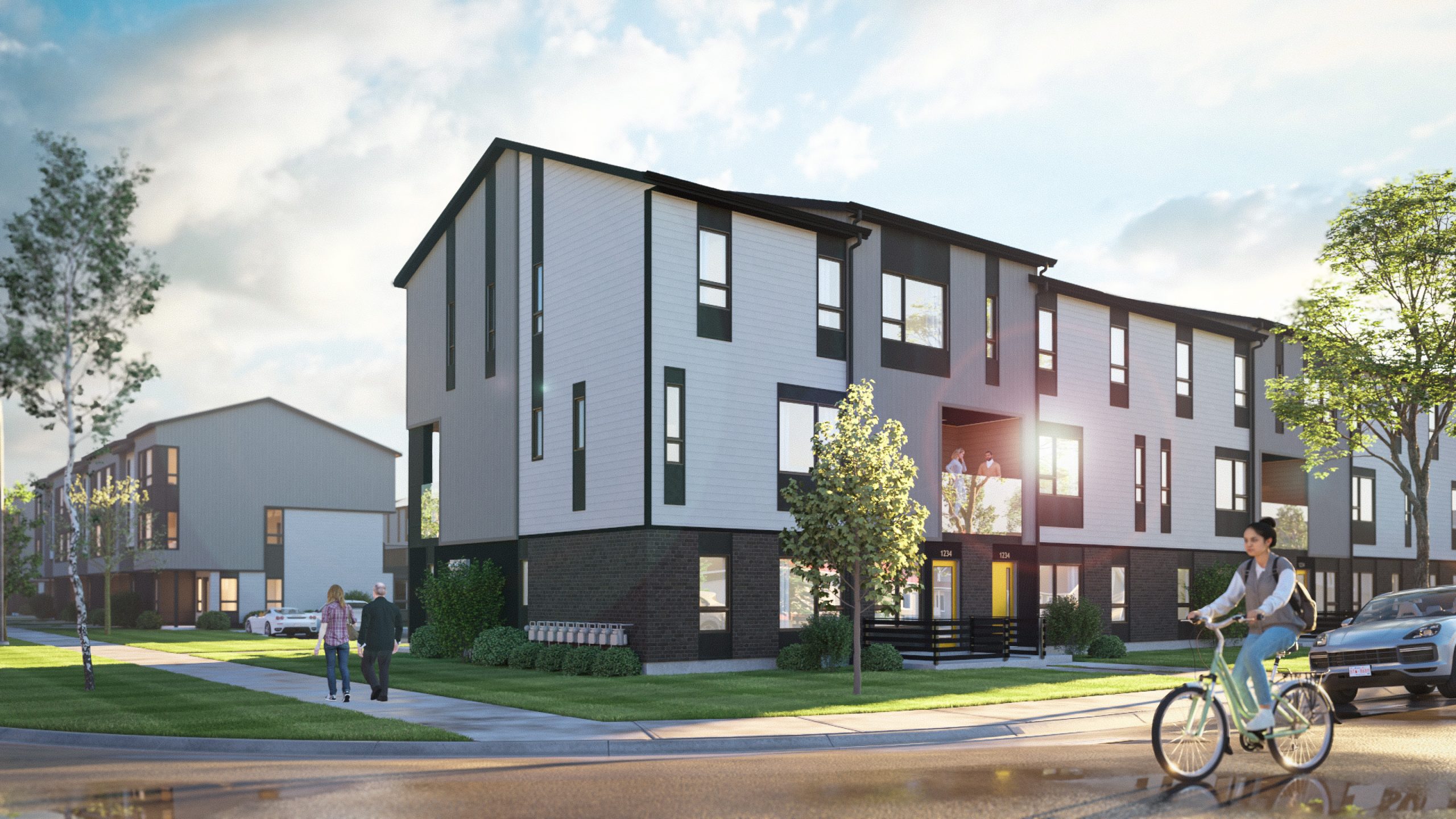 Architectural rendering of the Greystone South community featuring contemporary stacked townhomes, landscaped lawns, sidewalks, and residents walking and biking.