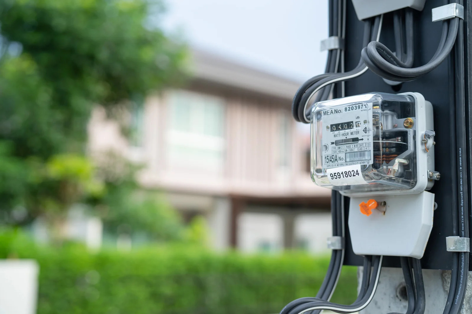 Residential electrical meter measuring home energy consumption for utility bills - Avalon Homes energy efficiency