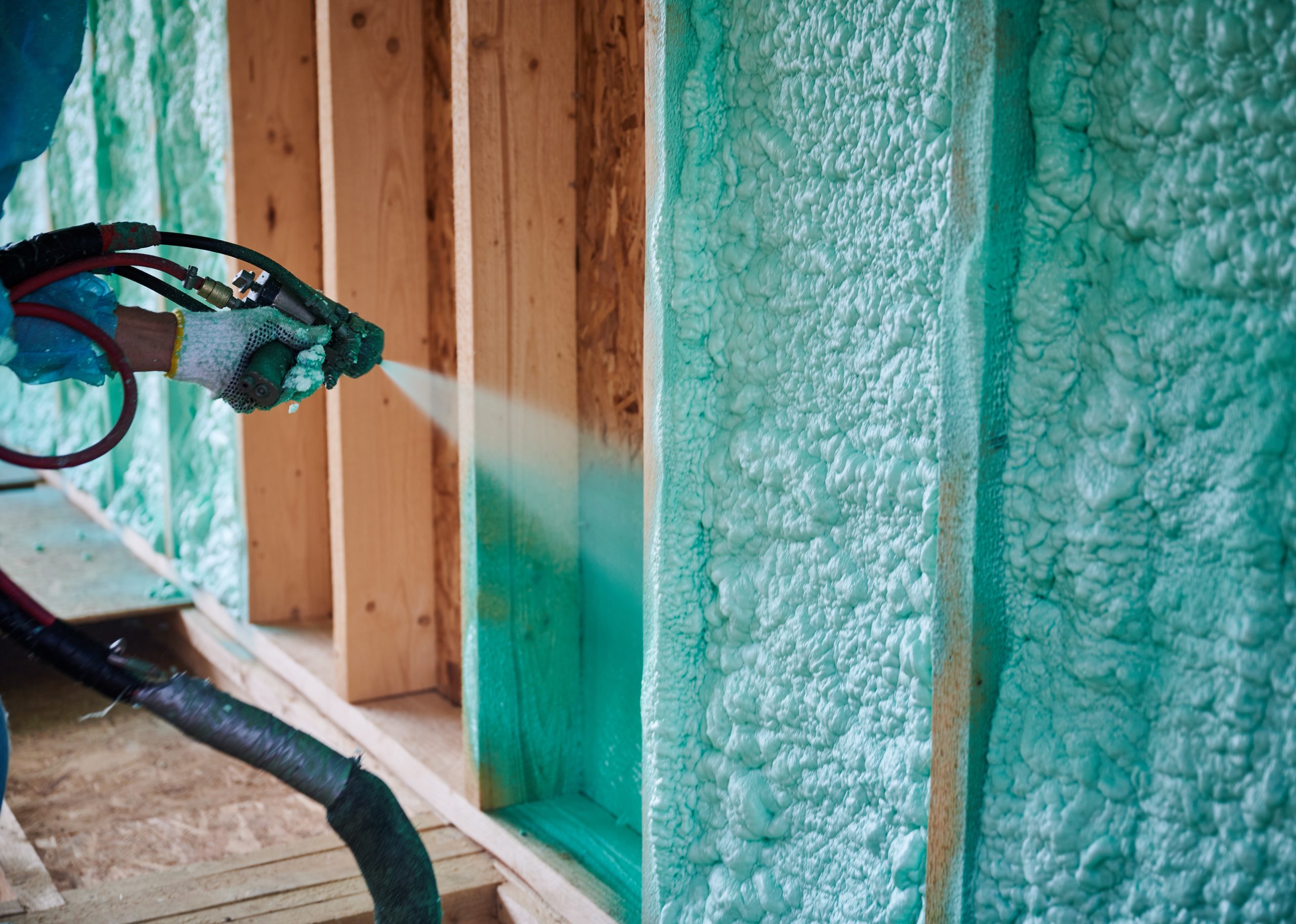 Professional spray foam insulation installation by Avalon Homes creating energy efficient building envelope