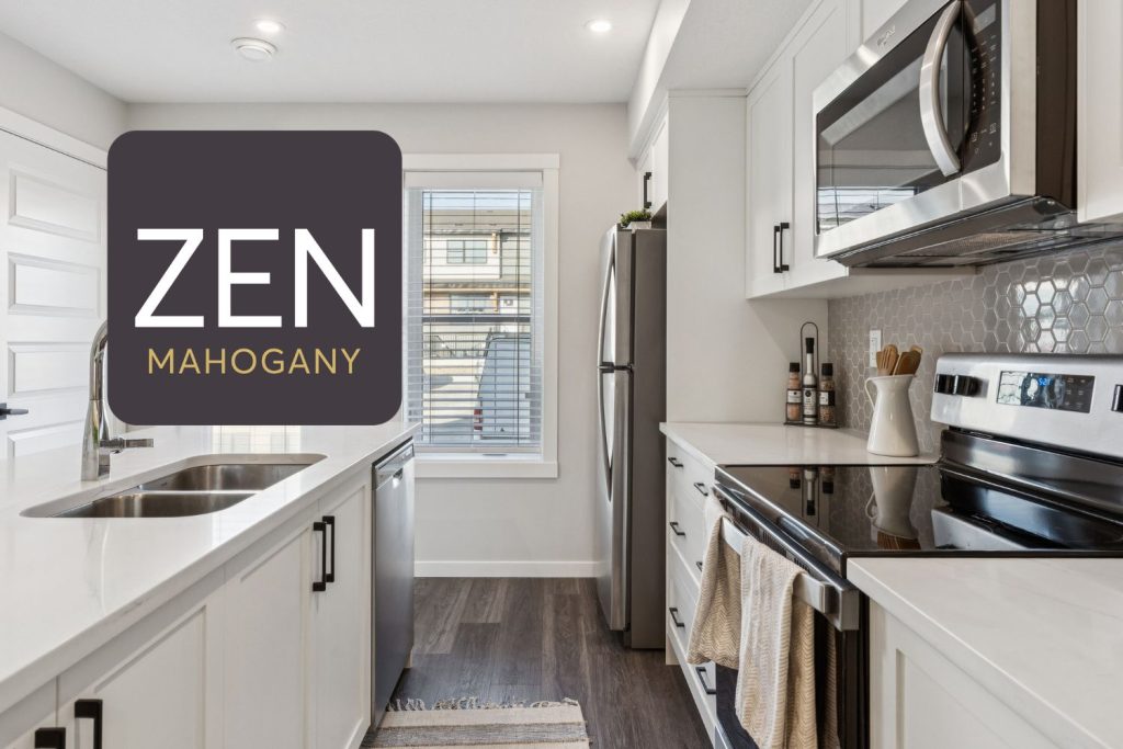 ZEN Mahogany townhome kitchen featuring a bright modern design with white cabinetry, stainless steel appliances, quartz island with seating, and contemporary finishes.