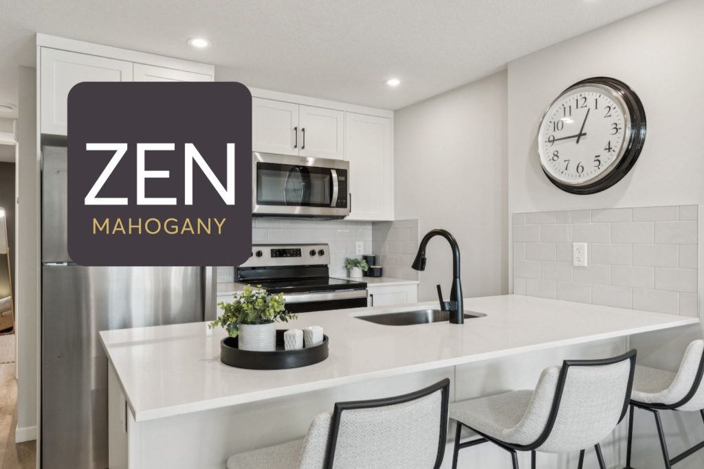 ZEN Mahogany townhome kitchen featuring a bright modern design with white cabinetry, stainless steel appliances, quartz island with seating, and contemporary finishes.