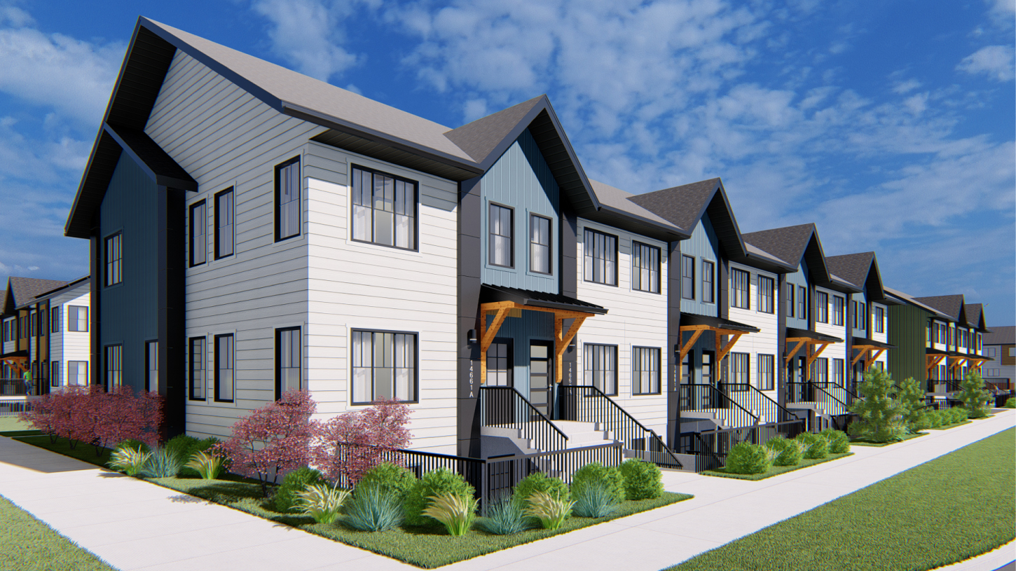 Exterior view of modern Avalon Homes townhomes featuring white siding, blue accents, and wooden porch supports under a blue sky in a Calgary-area community.