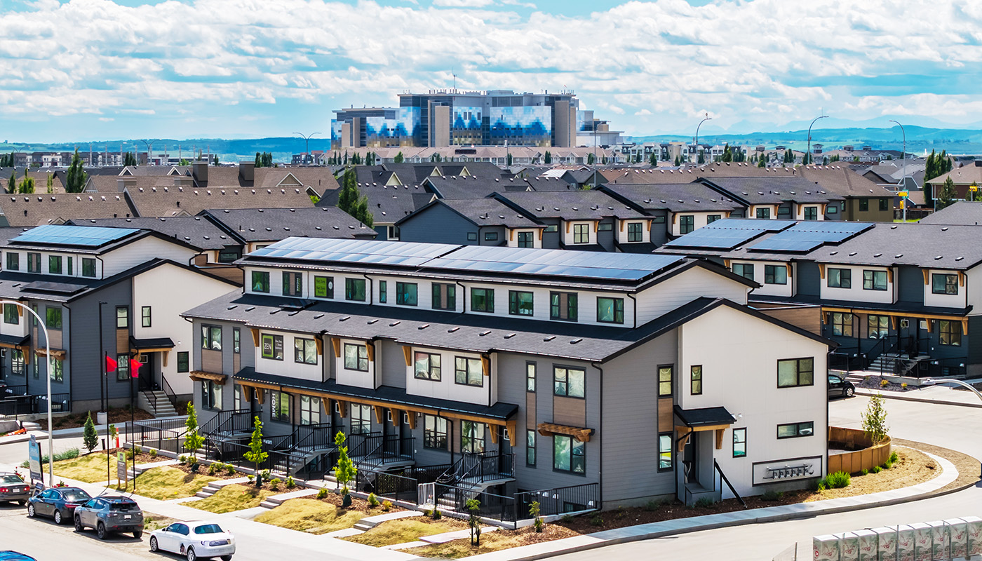 ZEN Mahogany buildings with focus on a three storey building in the forefront with solar panels