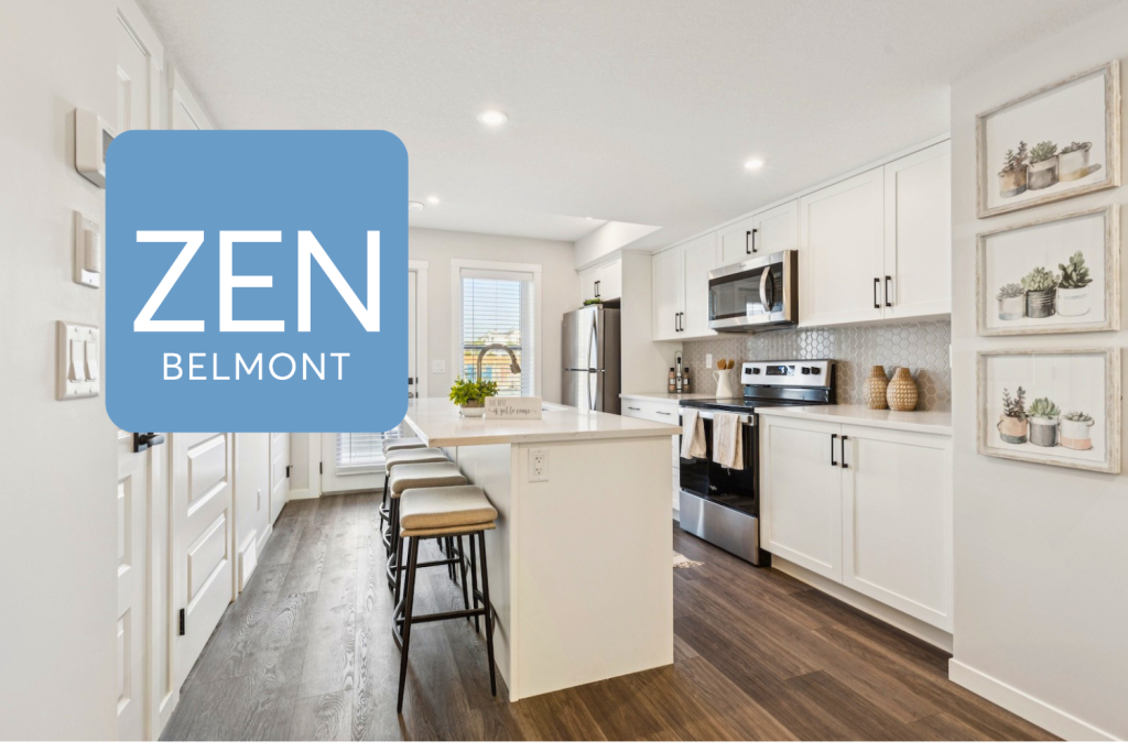 Ambrosia kitchen with white cabinets, large island with stools on one side.