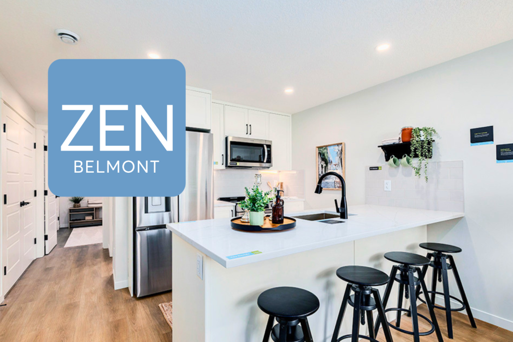 Braeburn townhome with white cabinetry and black stools at the island with quartz countertops.